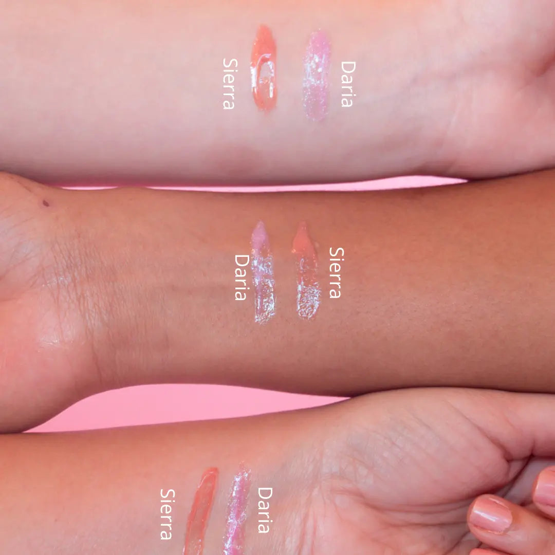 Lip gloss swatches on a person's arm with 'Sierra' and 'Daria' labels.
