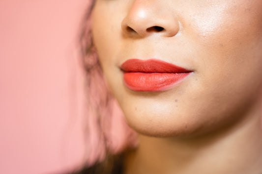 red orange terracotta velvet matte liquid lipstick on medium tan skin model