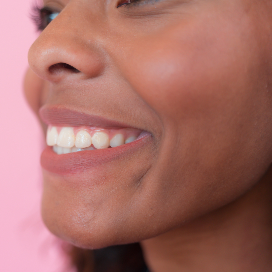 dark skin model sideways showing lip liner on lips