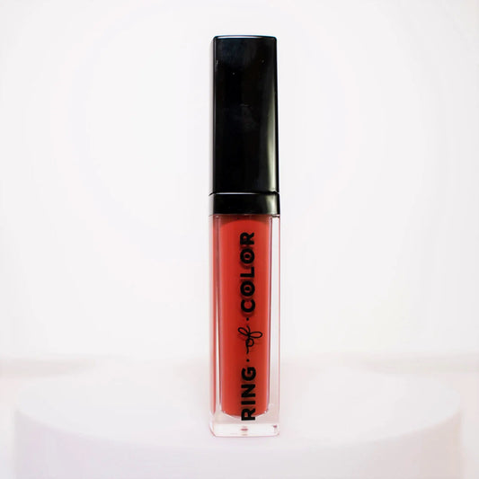 red orange Lipstick with black cap and visible brand name on a white background