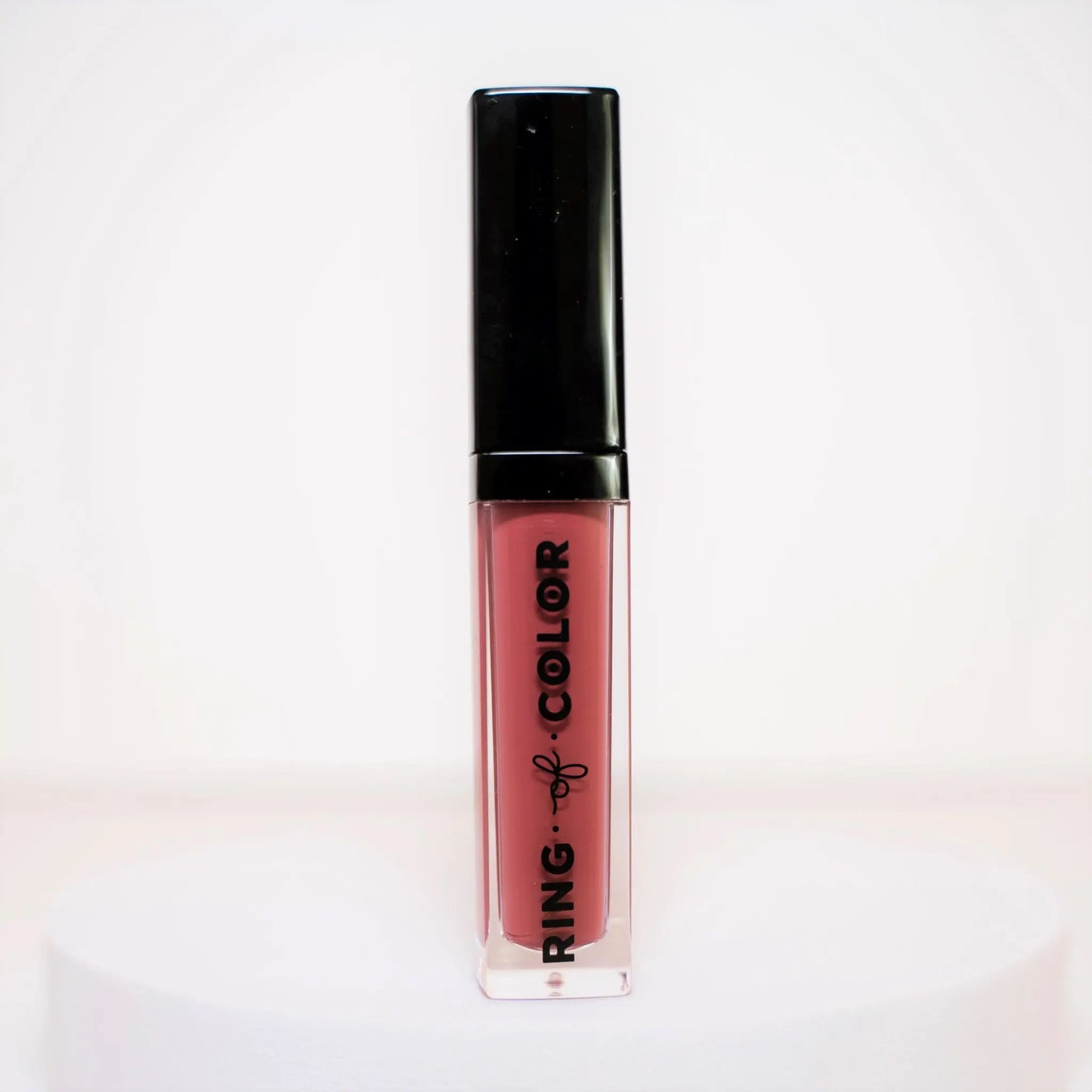 Lipstick with black cap and visible brand name on a white background