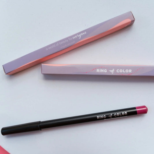 Lip liner with pink cap and black body on a white background, featuring 'Ring of Color' branding.