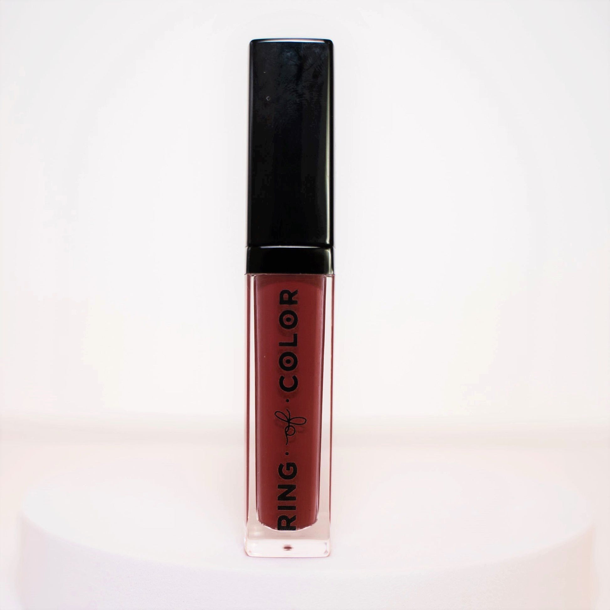 velvet matte liquid lipstick bottle with deep cranberry shade